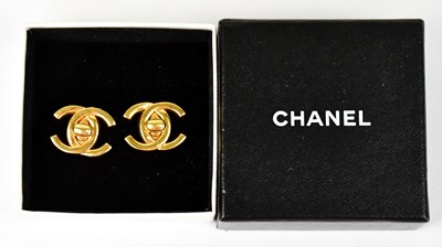 Lot 1387 - CHANEL; a pair of gold-coloured double 'C'...