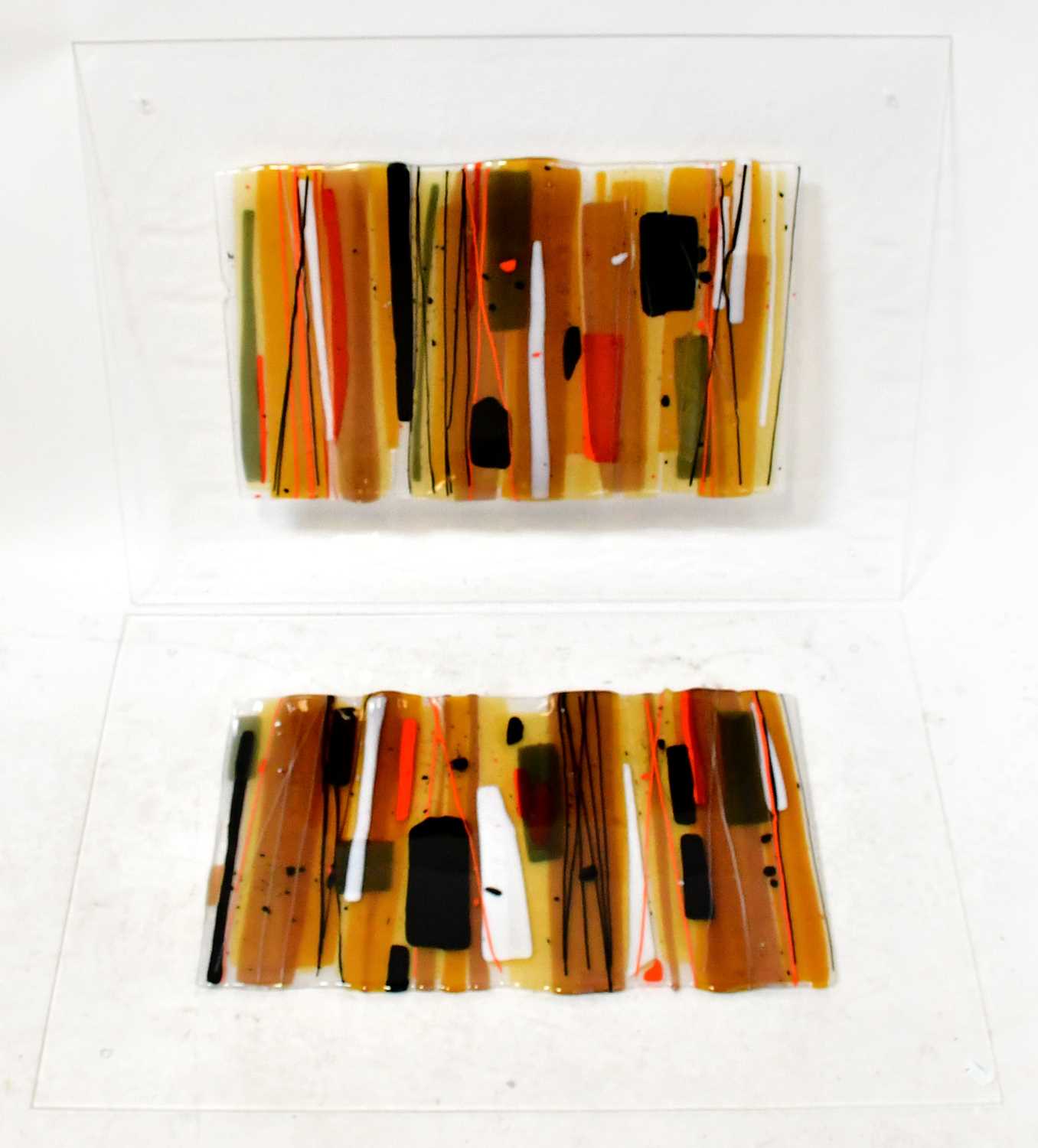 Lot 211 - A pair of decorative glass panels, with fused...