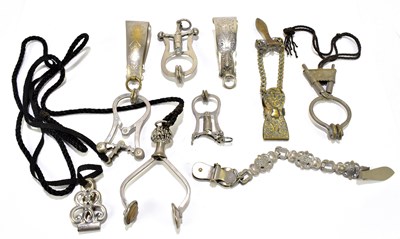 Lot 67 - A collection of Victorian skirt lifters