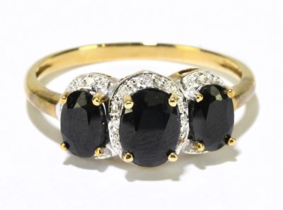 Lot 1220 - A 9ct yellow gold sapphire and diamond ring,...