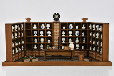 Lot 1328 - A vintage apothecary shop model, height 25cm,...