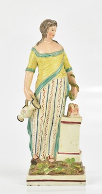 Lot 1616 - A 19th century pearl ware figure of Hygeia,...