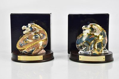 Lot 2414 - ROYAL CROWN DERBY; two paperweights on wooden...