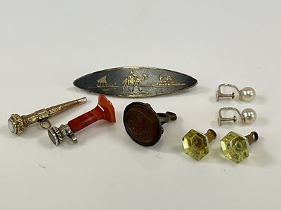 Lot 538 - A white metal and niello enamelled brooch, a...