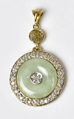Lot 858 - A 9ct yellow gold pendant set with a pale...