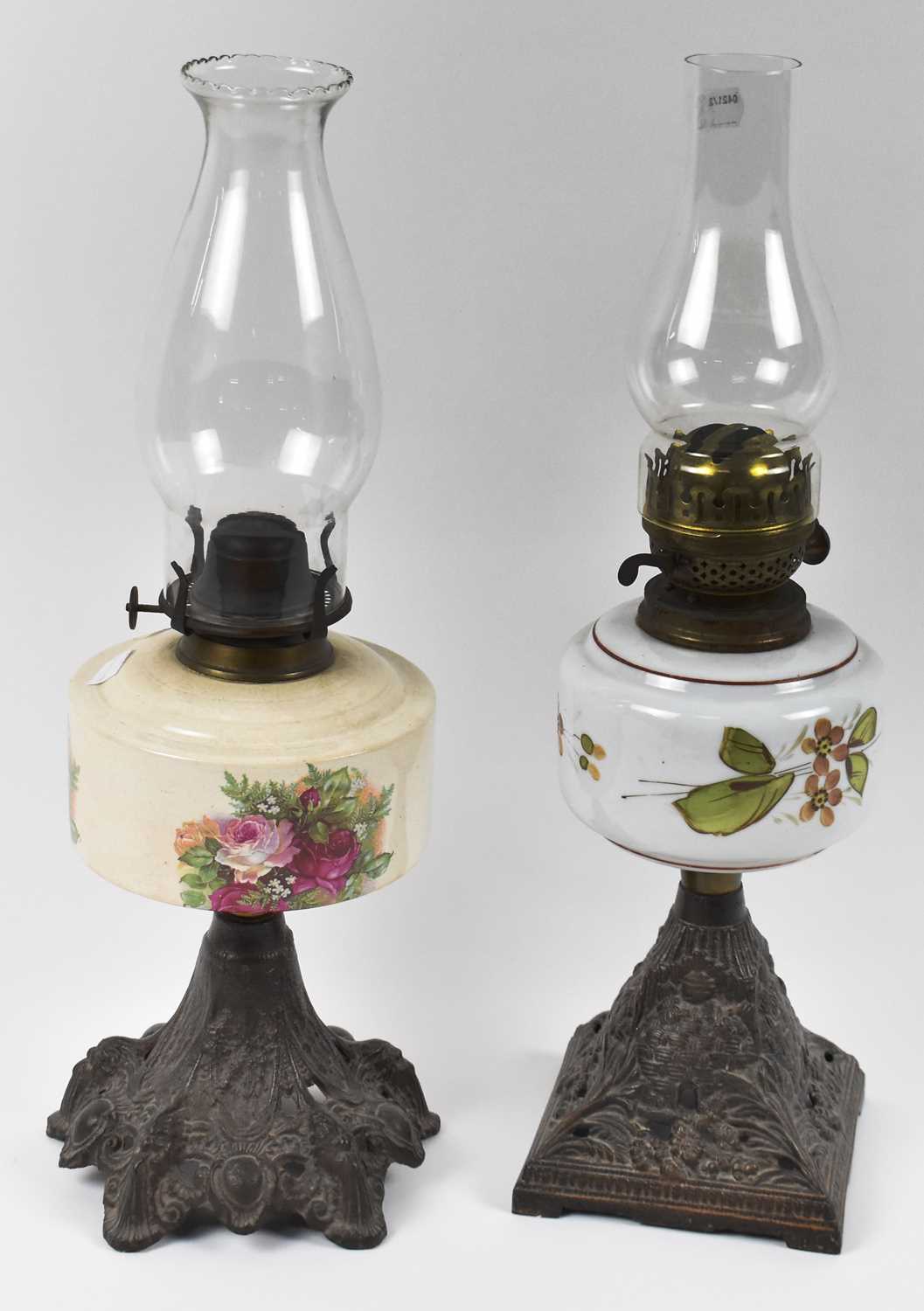 Lot 128 Two Victorian oil lamps with decorative cast