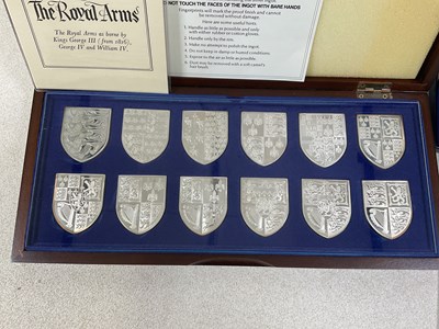 Lot 562 - DANBURY MINT; a cased set of twelve silver...