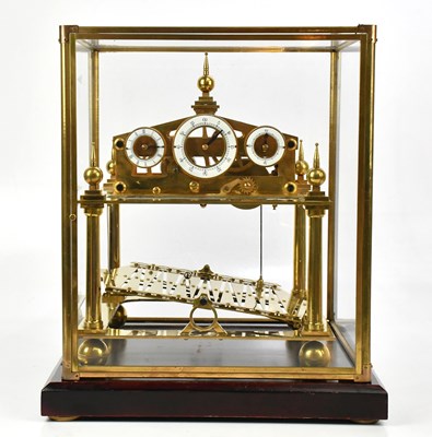 Lot 1262 - A good brass rolling ball clock, set with...