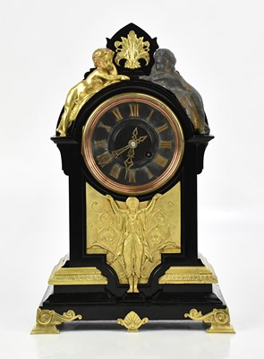 Lot 1265 - A Victorian slate mantel clock with arched top...