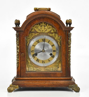Lot 1289 - A reproduction oak and walnut mantel clock...