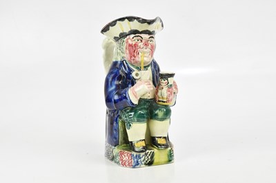 Lot 1645 - A 19th century spongeware Toby jug, formed as...