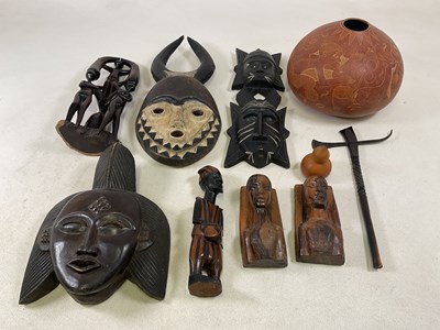 Lot 158 - A collection of wooden African tribal items,...