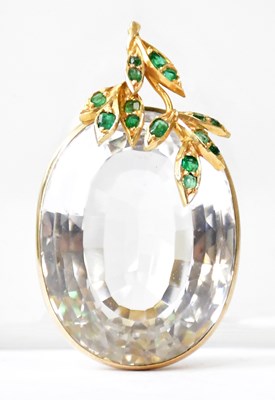 Lot 865 - A yellow metal pendant set with an oval cut...