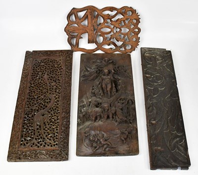Lot 711 - Four carved panels comprising a heavily relief...