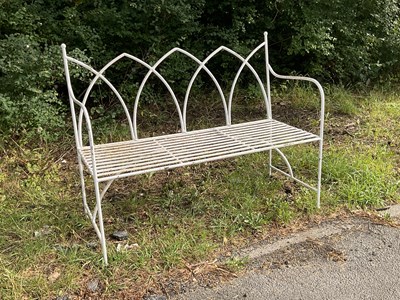 Lot 1244 - A white painted Gothic style garden bench,...