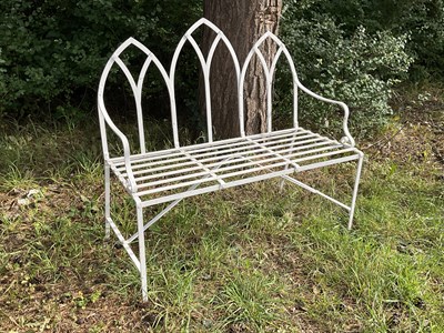 Lot 1220 - A white painted Gothic style garden bench,...