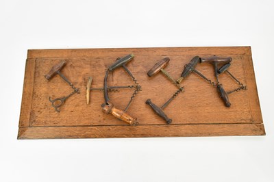 Lot 1455 - Twelve early 20th century corkscrews mounted...