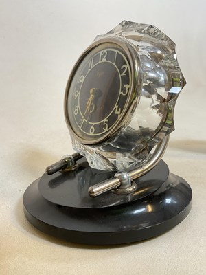 Lot 641 - Three mid-20th century clocks, including a...