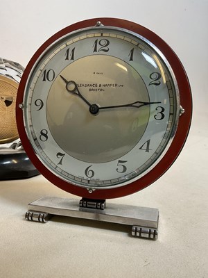 Lot 641 - Three mid-20th century clocks, including a...