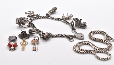 Lot 551 - A yellow metal '21' key pendant, a silver...