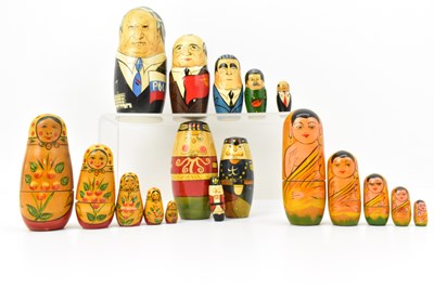 Lot 522 - Four sets of wooden Russian dolls including...