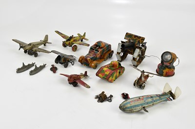 Lot 2025 - A collection of tinplate toys, to include a...
