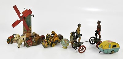 Lot 2117 - A collection of novelty tinplate toys, to...
