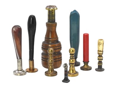 Lot 43 - A collection of nine hand held seals, some set...