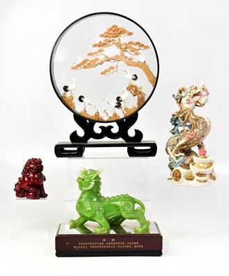 Lot 526 - A modern resin jade-coloured figure of a dog...