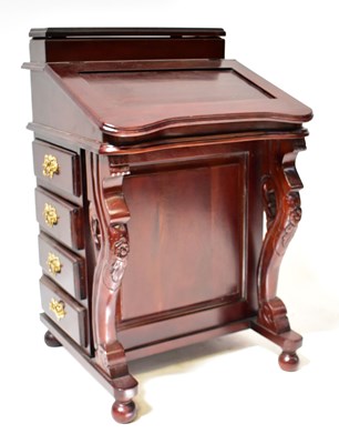 Lot 55 - A reproduction mahogany davenport with lift-up...