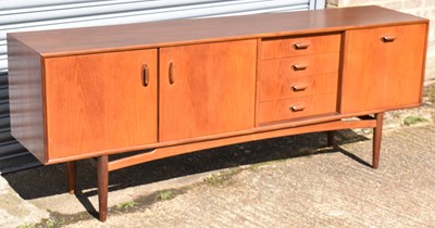 Lot 75 - G PLAN; a teak sideboard with two cupboard...