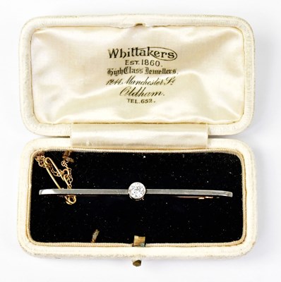 Lot 1402 - A yellow metal bar brooch set with a single...