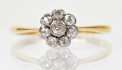 Lot 1290 - An 18ct yellow gold ring with eight diamonds...