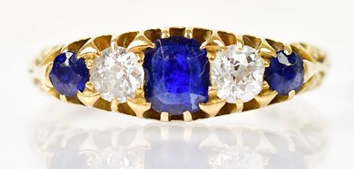 Lot 1285 - An 18ct yellow gold ring set with three...