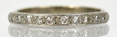 Lot 1296 - An 18ct white gold half eternity ring set with...