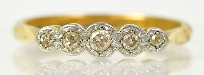 Lot 1295 - An 18ct yellow gold ring set with five...