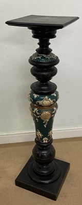 Lot 704 - An ebonised soft wood and majolica pedestal,...