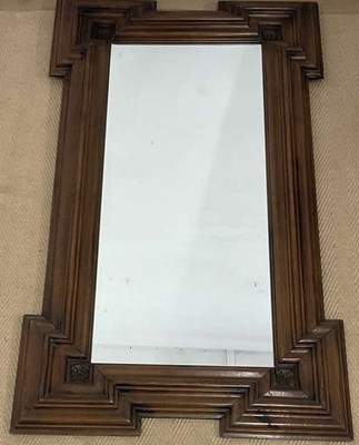 Lot 726 - A Continental walnut wall mirror with moulded...