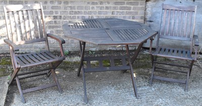 Lot 103 - A modern wooden garden table and set of four...