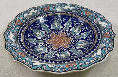 Lot 337 - An Iznik bowl inscribed 'Special Handmade...