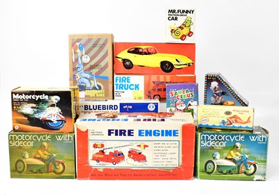 Lot 392 - Various tinplate and other boxed vehicles,...