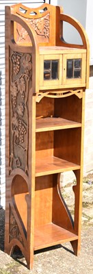 Lot 67 - An Art Nouveau walnut narrow bookcase, the...