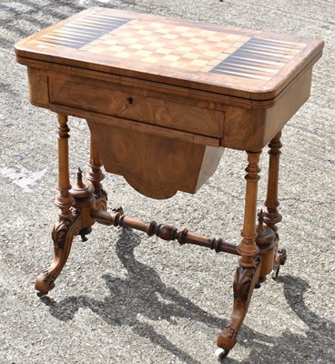 Lot 22 - A walnut crossbanded and inlaid fold over...