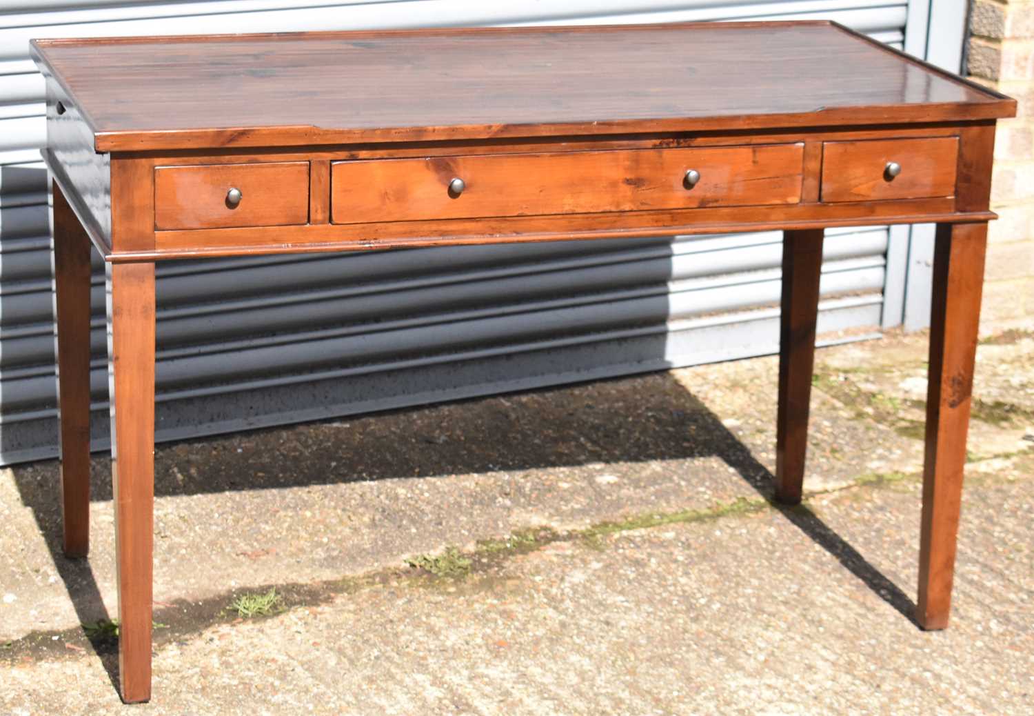 Lot 52 - A mahogany side table,from OKA, height 79cms,...