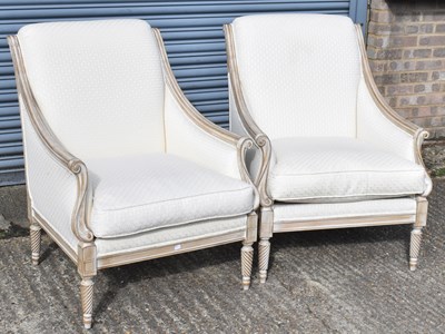 Lot 28 - A pair of modern cream upholstered armchairs...