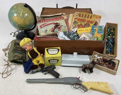 Lot 135 - A leather suitcase containing toys from the...