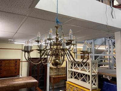 Lot 130 - An eighteen branch brass chandelier, 58cms...