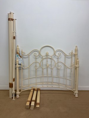 Lot 772 - A cream painted metal framed bed, 128 x 142 x...