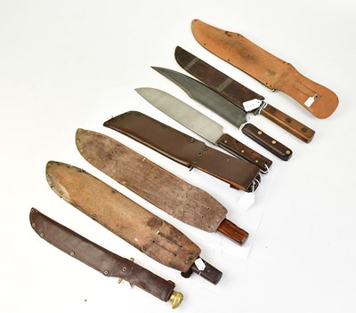 Lot 902 - Seven Bowie knives including a wooden-handled...