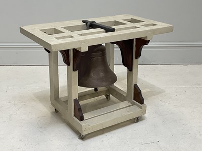 Lot 1407 - A large bell mounted on a white painted frame,...